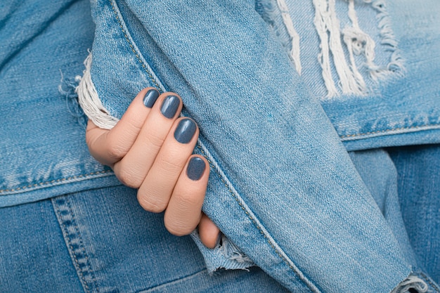 blue ragged denim fabric surface ...