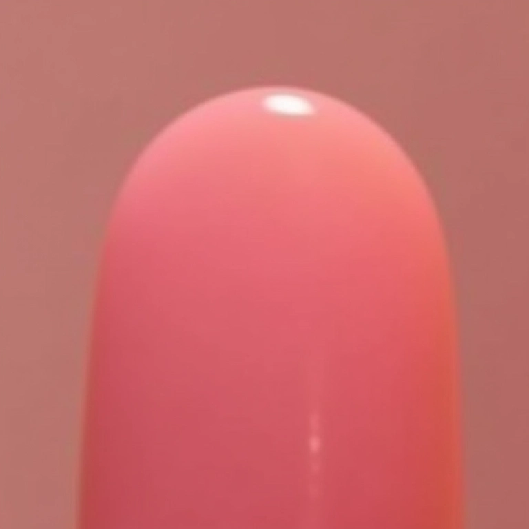 Unhas rosa degradê (ombré) suave.