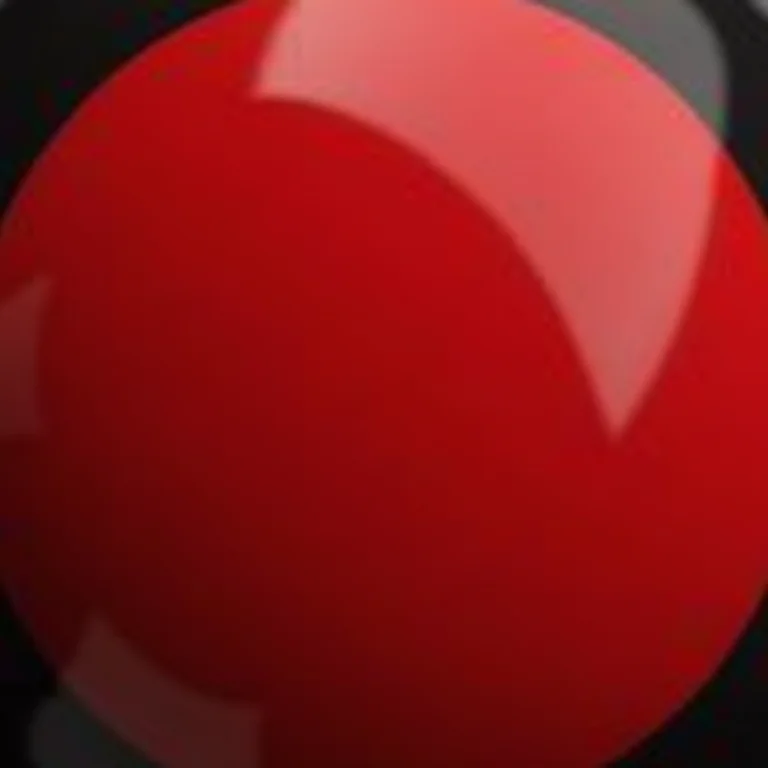 Unhas decoradas com desenhos geométricos em vermelho e preto