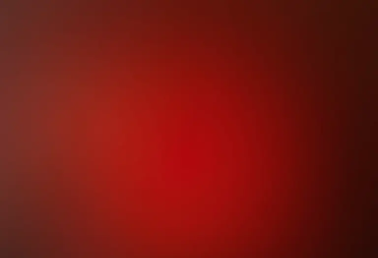 Unhas degradê vermelhas segurando perfume