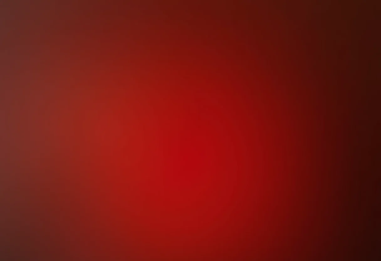 Unhas degradê vermelhas segurando perfume