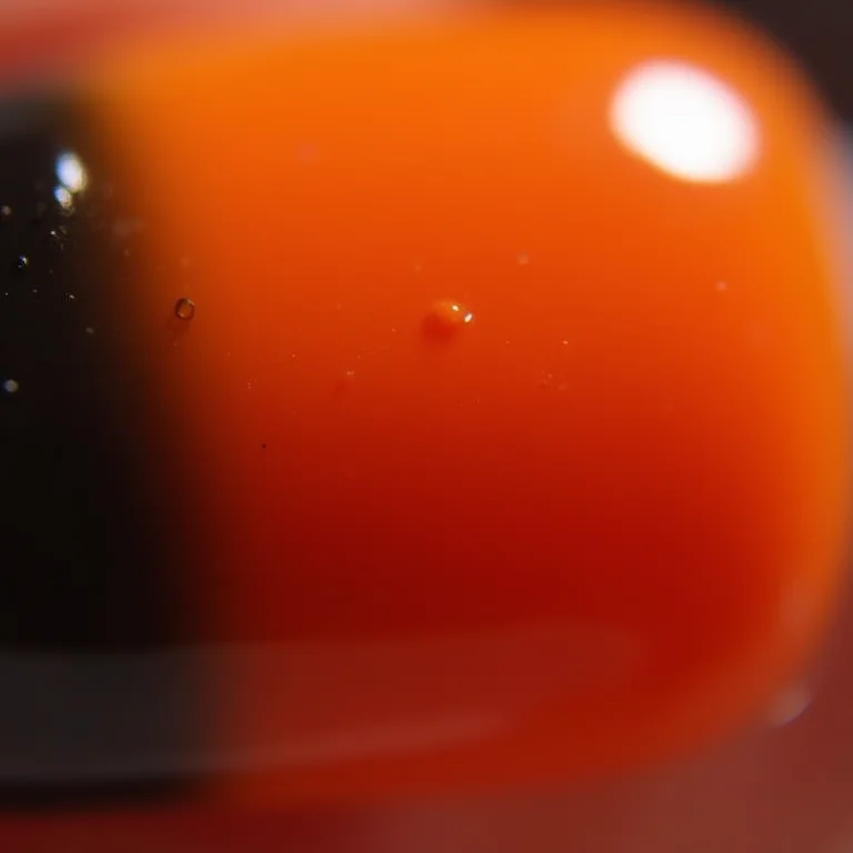 Unhas laranja degradê com preto